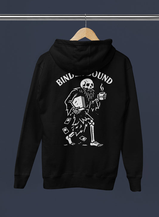 Black hoodie with a skeleton design and 'Binders Bound' text on a hanger against a dark background