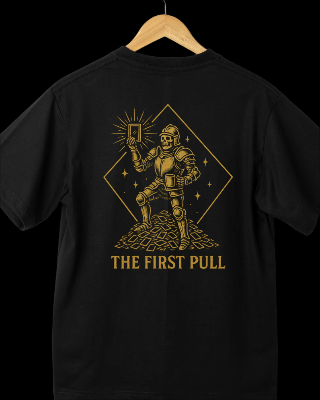 Black t-shirt with gold robot graphic and 'The First Pull' text on a white background